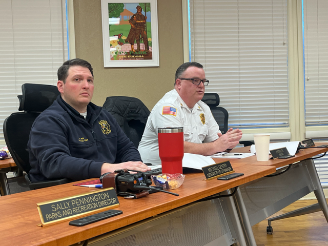 Fire Chief Justin Lee shares a slideshow with city commissioners about fire department staffing. Lee said hiring a few more full-time staff would help provide 24-hour coverage and prevent burnout of volunteers. 