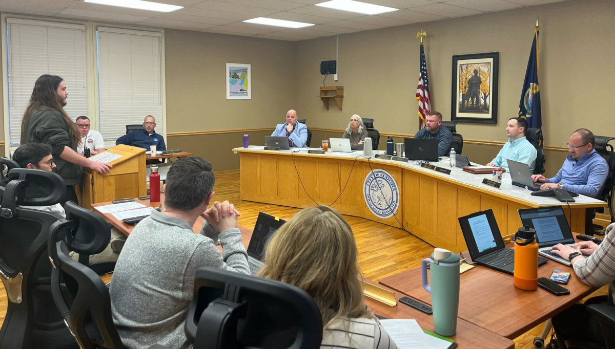 Assistant to the City Manager Michael Gentry speaks to the City Commission Monday. A resolution approved by commissioners Monday created a registration system for short-term rentals, like those from Airbnb and Vrbo.
